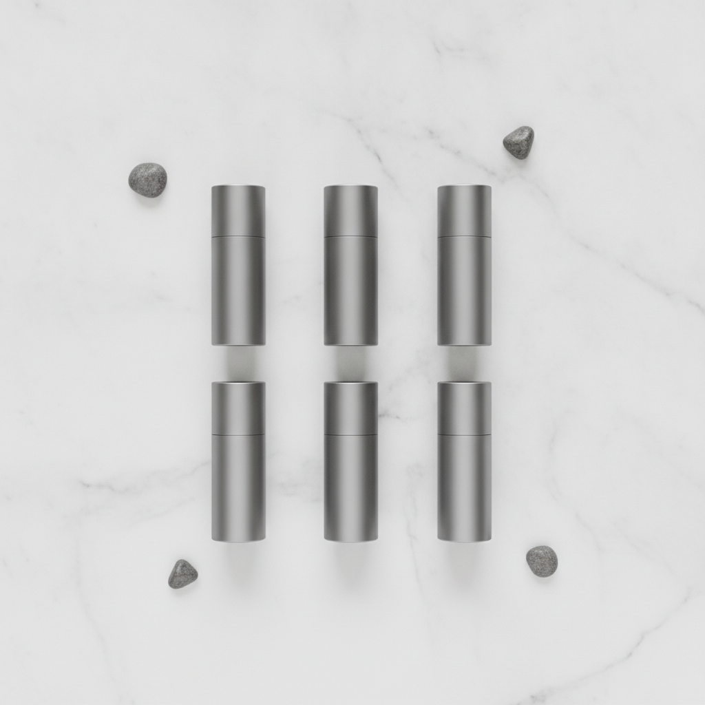 Minimalist travel fragrance set in grey metallic containers